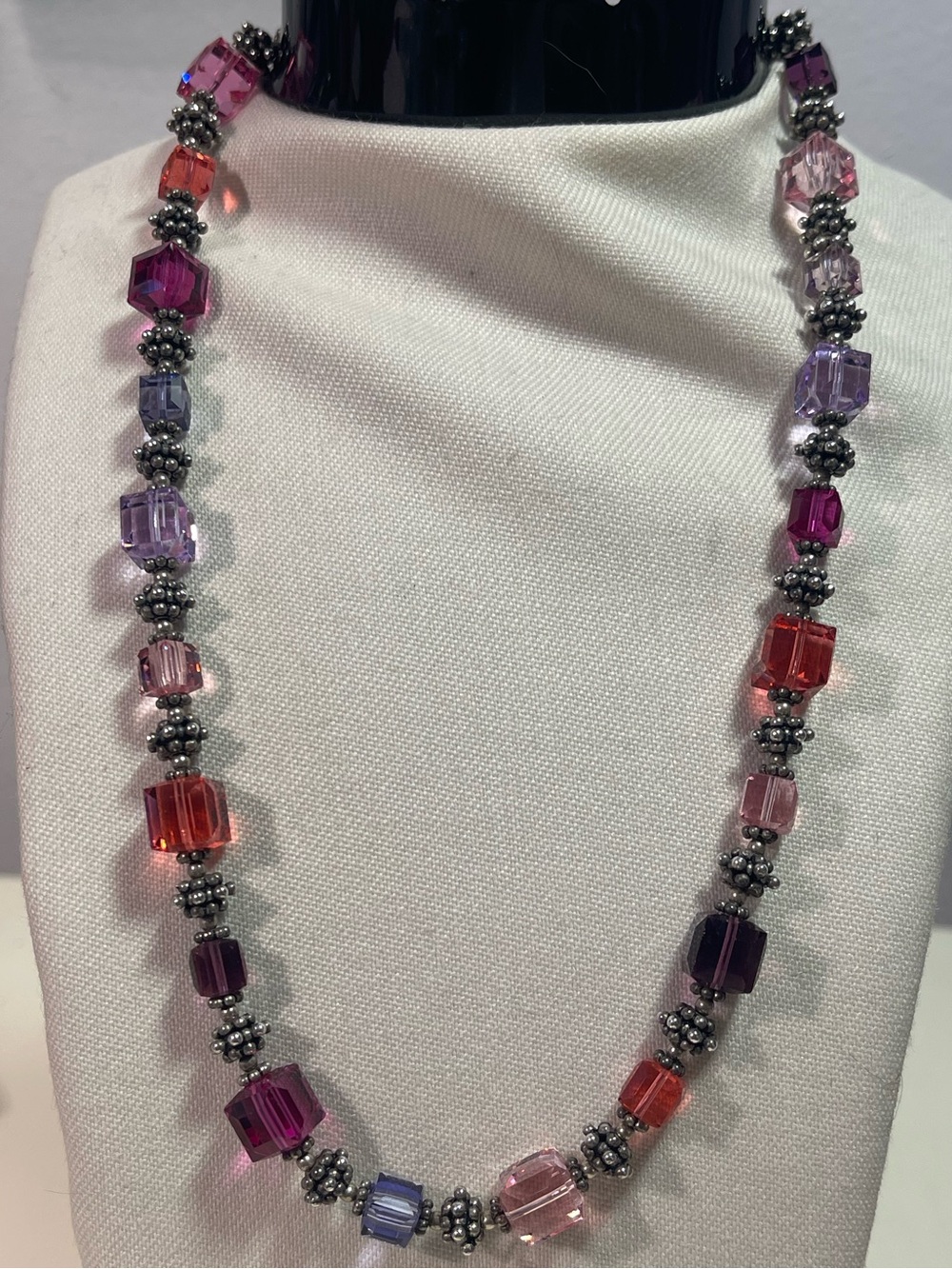 Multi-colored square crystal and silver-tone spacer necklace with toggle clasp
